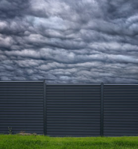 Symbol / Concepts, New fence, clouds behind him Symbol / Concepts, New fence, clouds behind him
